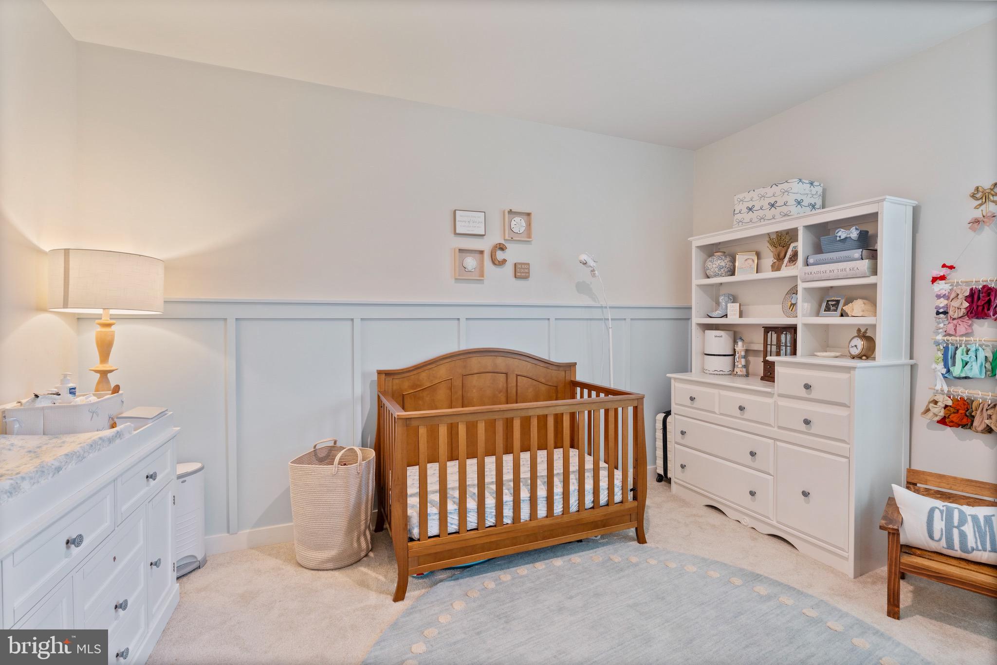 10411 Resort Road, Unit B Ellicott City, MD 21042 - Photo 26 of 36 a bedroom with a bed and a cabinets