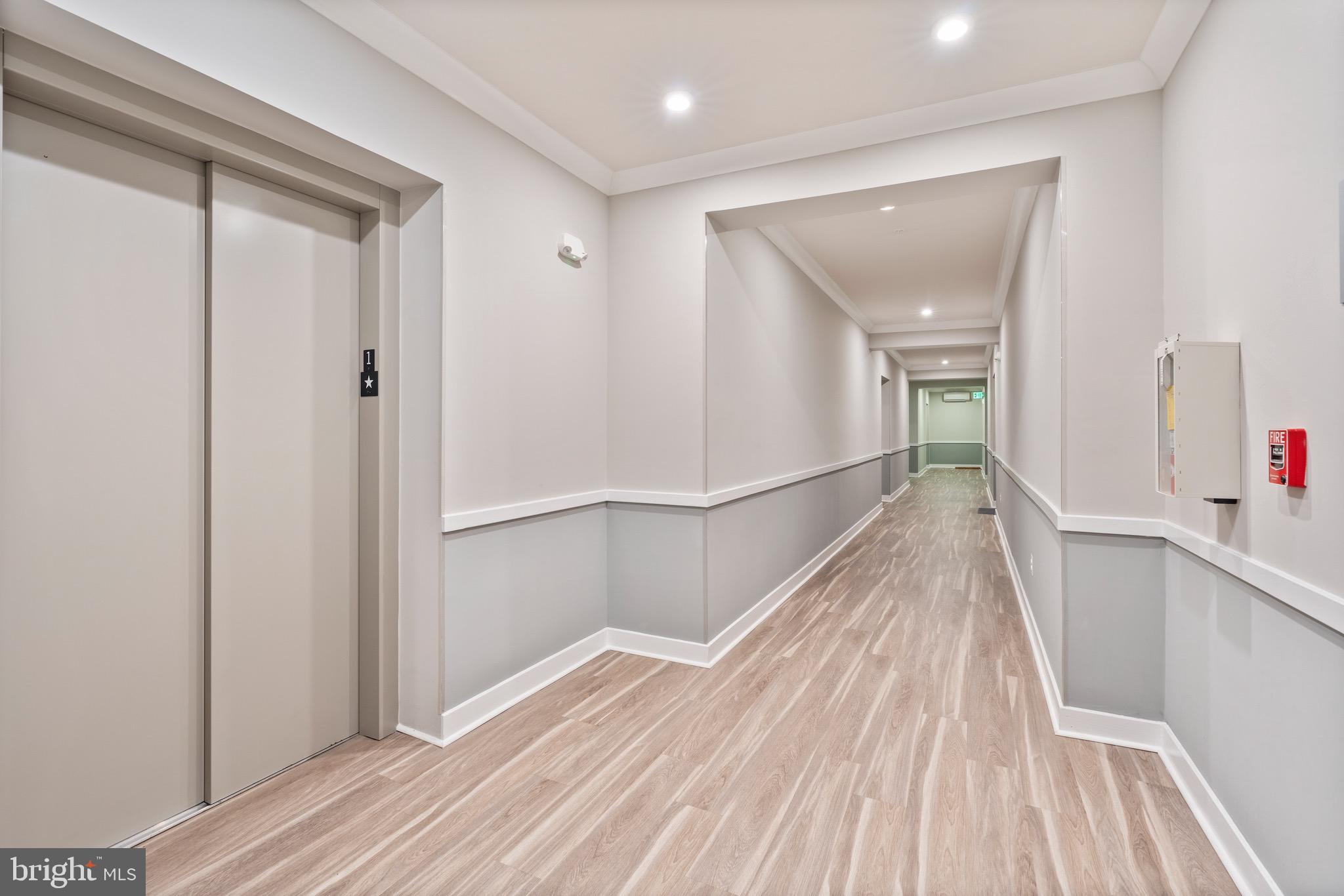 10411 Resort Road, Unit B Ellicott City, MD 21042 - Photo 30 of 36 a view of a hallway with wooden floor and staircase