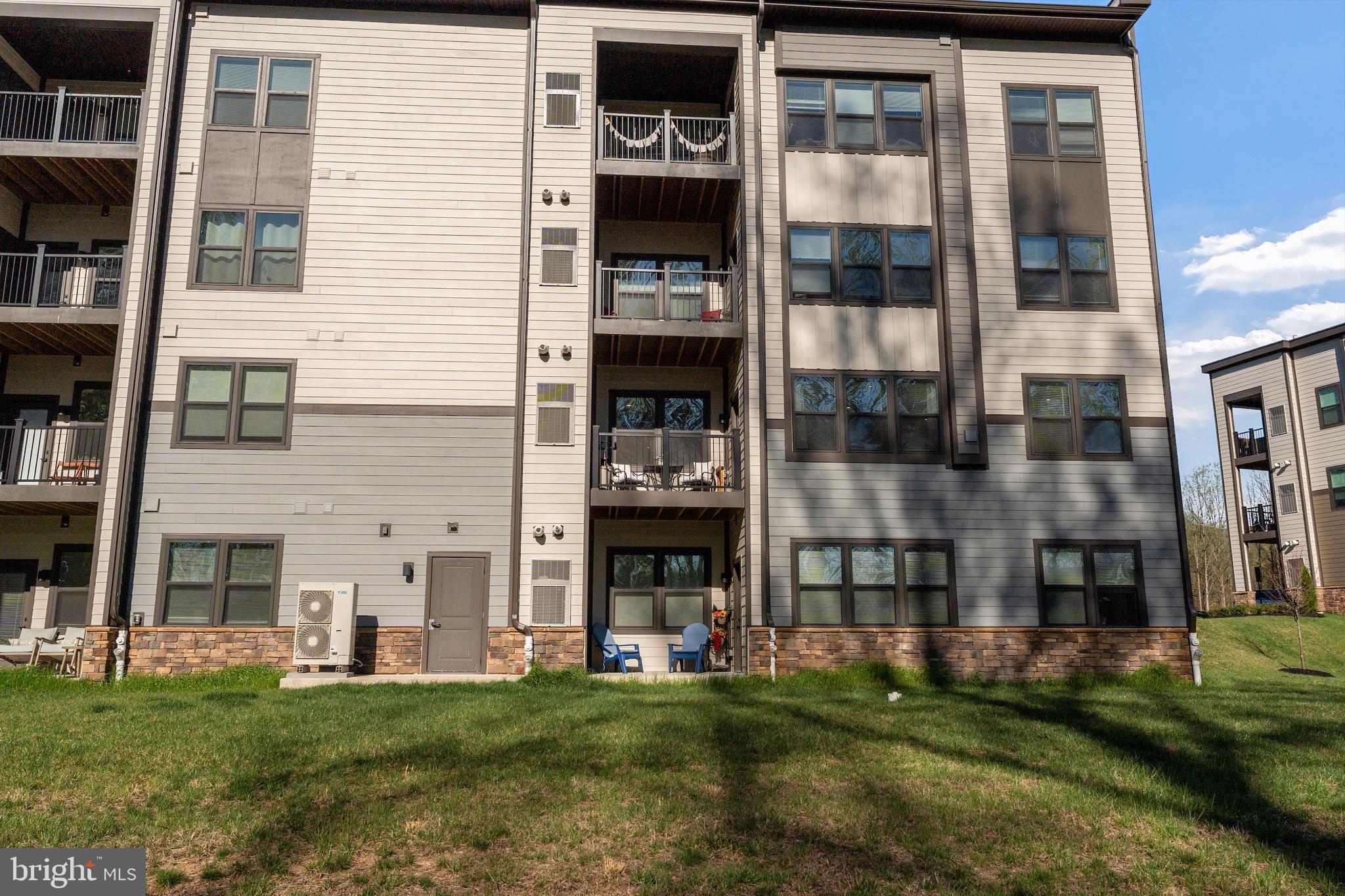10411 Resort Road, Unit B Ellicott City, MD 21042 - Photo 35 of 36 a view of building with yard