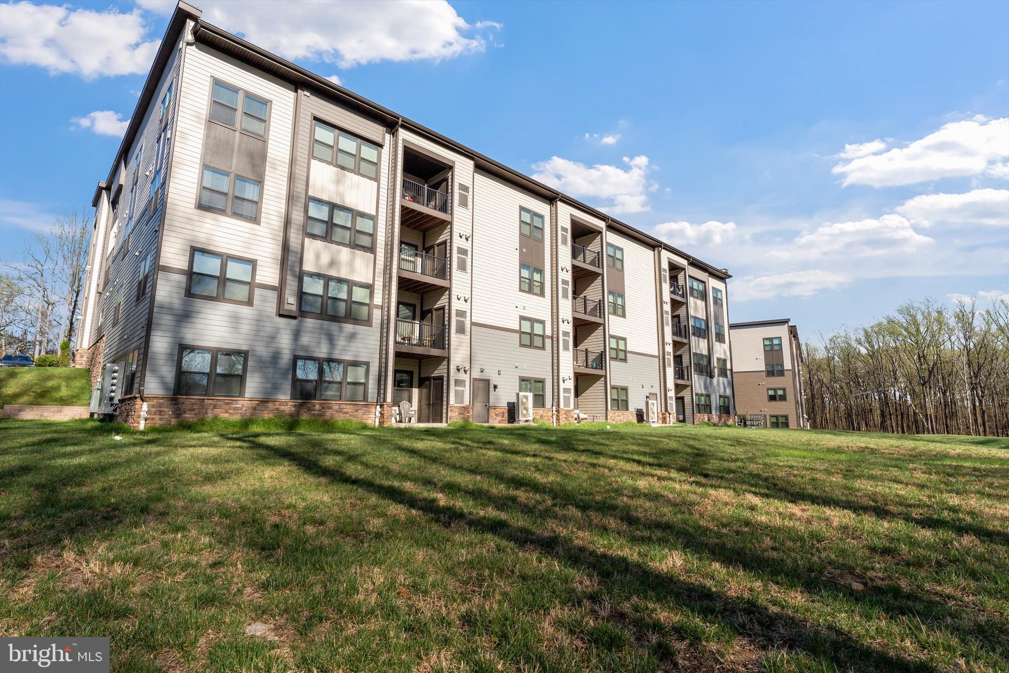 10411 Resort Road, Unit B Ellicott City, MD 21042 - Photo 36 of 36 a view of building with yard