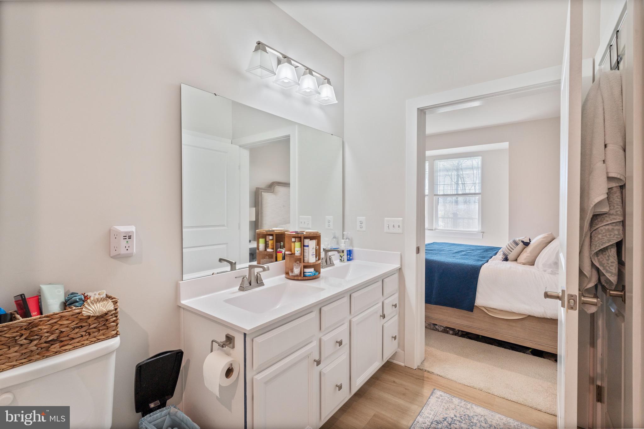 10411 Resort Road, Unit B Ellicott City, MD 21042 - Photo 6 of 36 a bathroom with a sink double vanity and a mirror