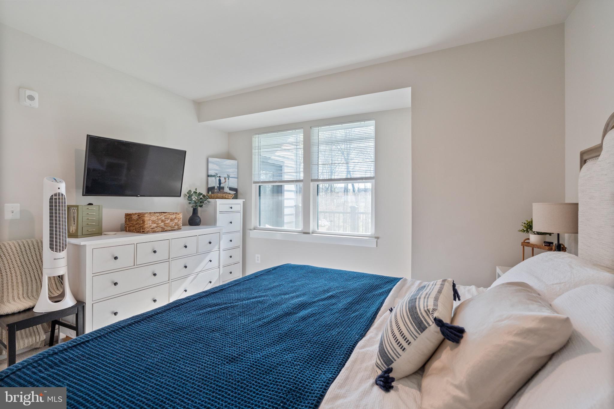 10411 Resort Road, Unit B Ellicott City, MD 21042 - Photo 7 of 36 a bedroom with a bed and flat screen tv