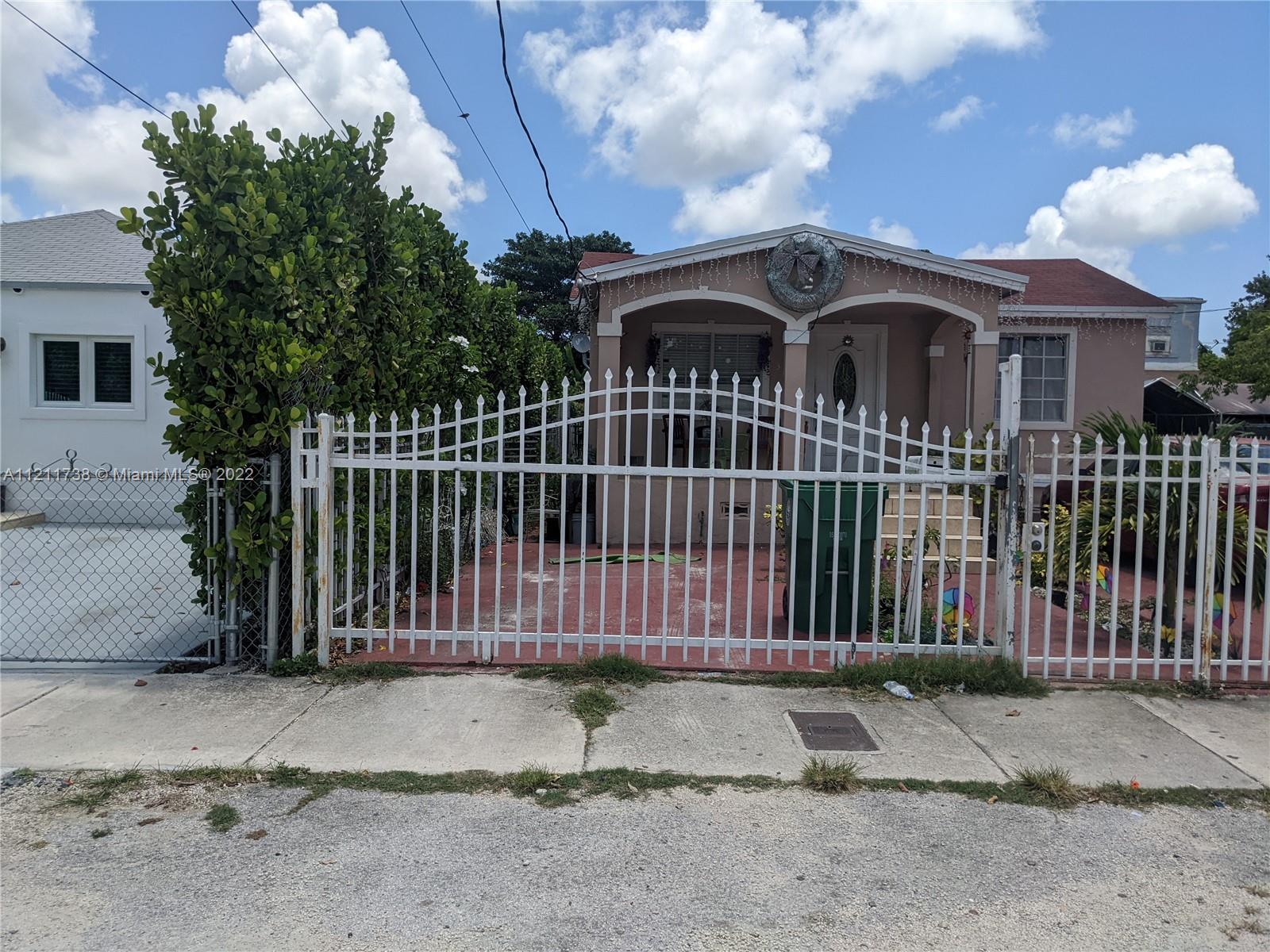 Allapattah Miami, FL 33142 - Photo 2 of 4 a front view of a house with a garden