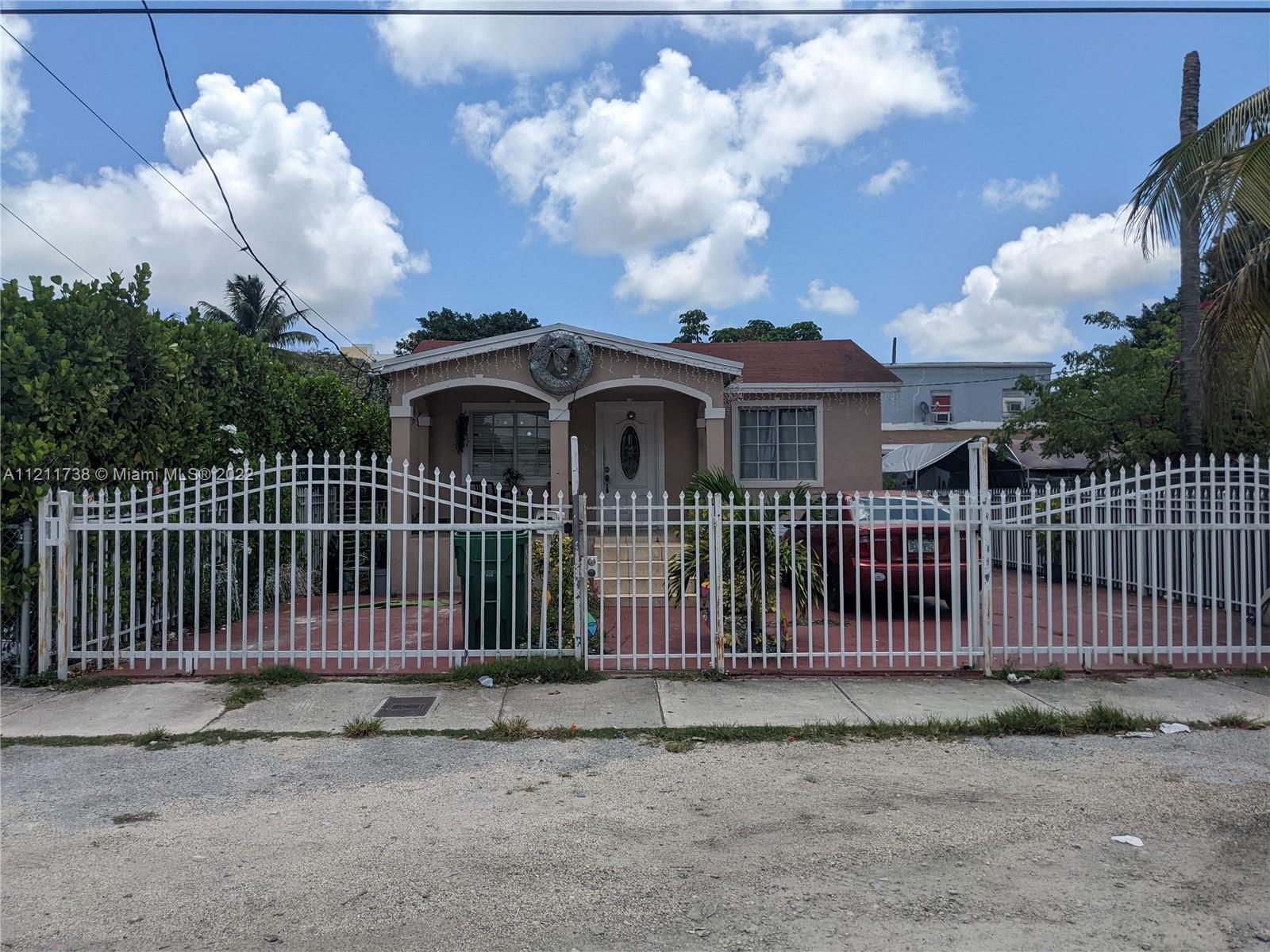 Allapattah Miami, FL 33142 - Photo 3 of 4 a front view of a house with a garden