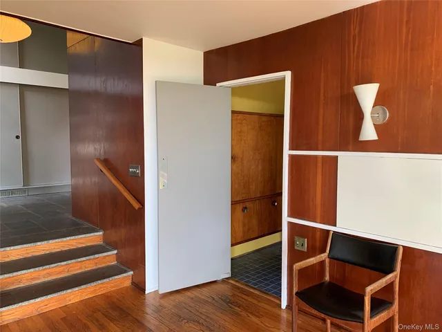 a view of a living room with a wooden floor