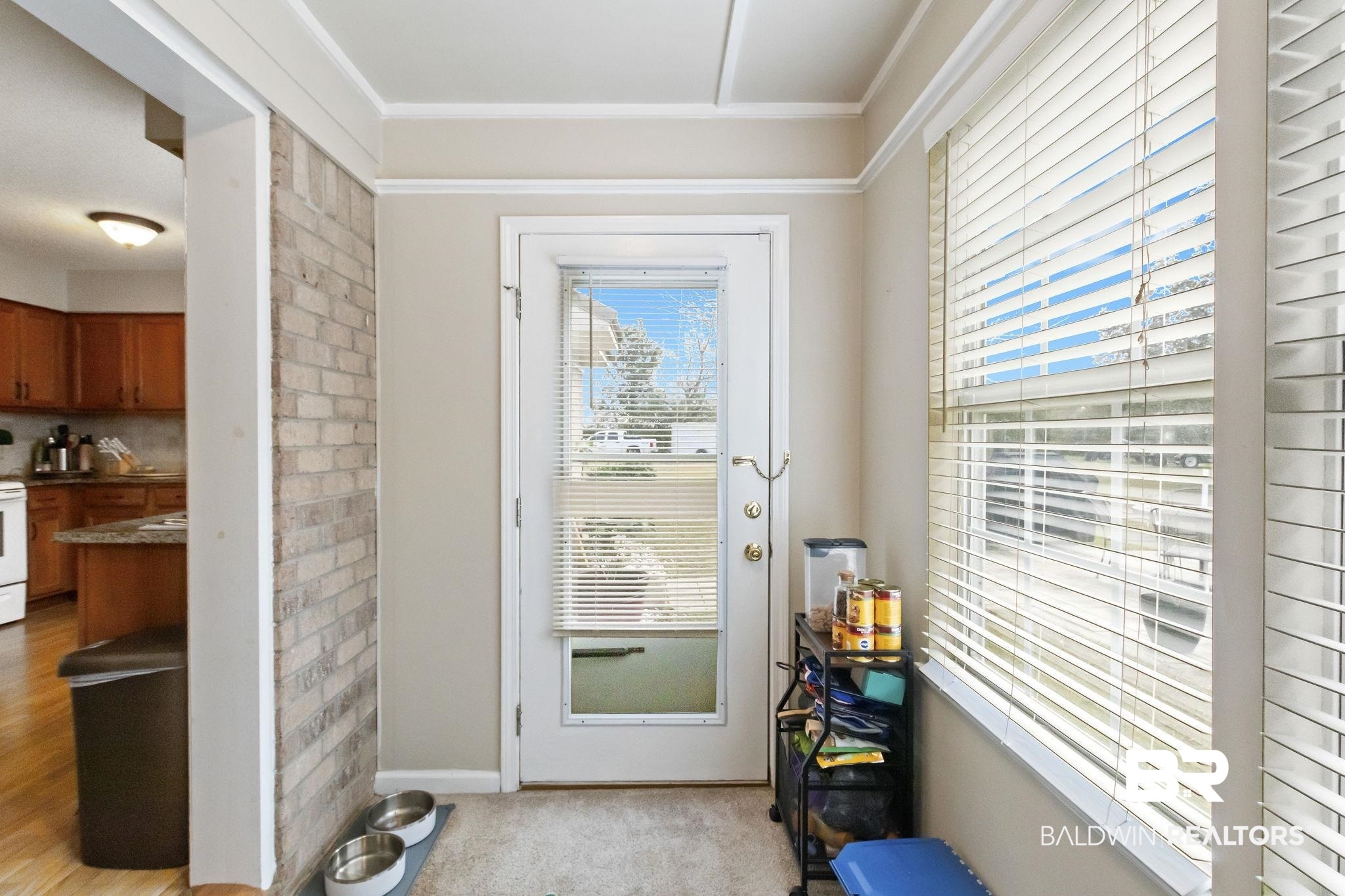 14031 Brook Hollow Road Summerdale, AL 36580 - Photo 25 of 56 Entryway with light carpet and crown molding