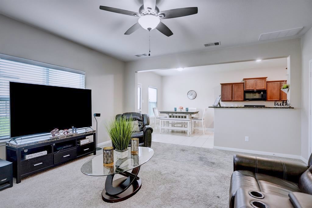1303 Emerald Stone Drive Rosharon, TX 77583 - Photo 4 of 25 Bright and airy living area with an open layout designed for comfort and connection.