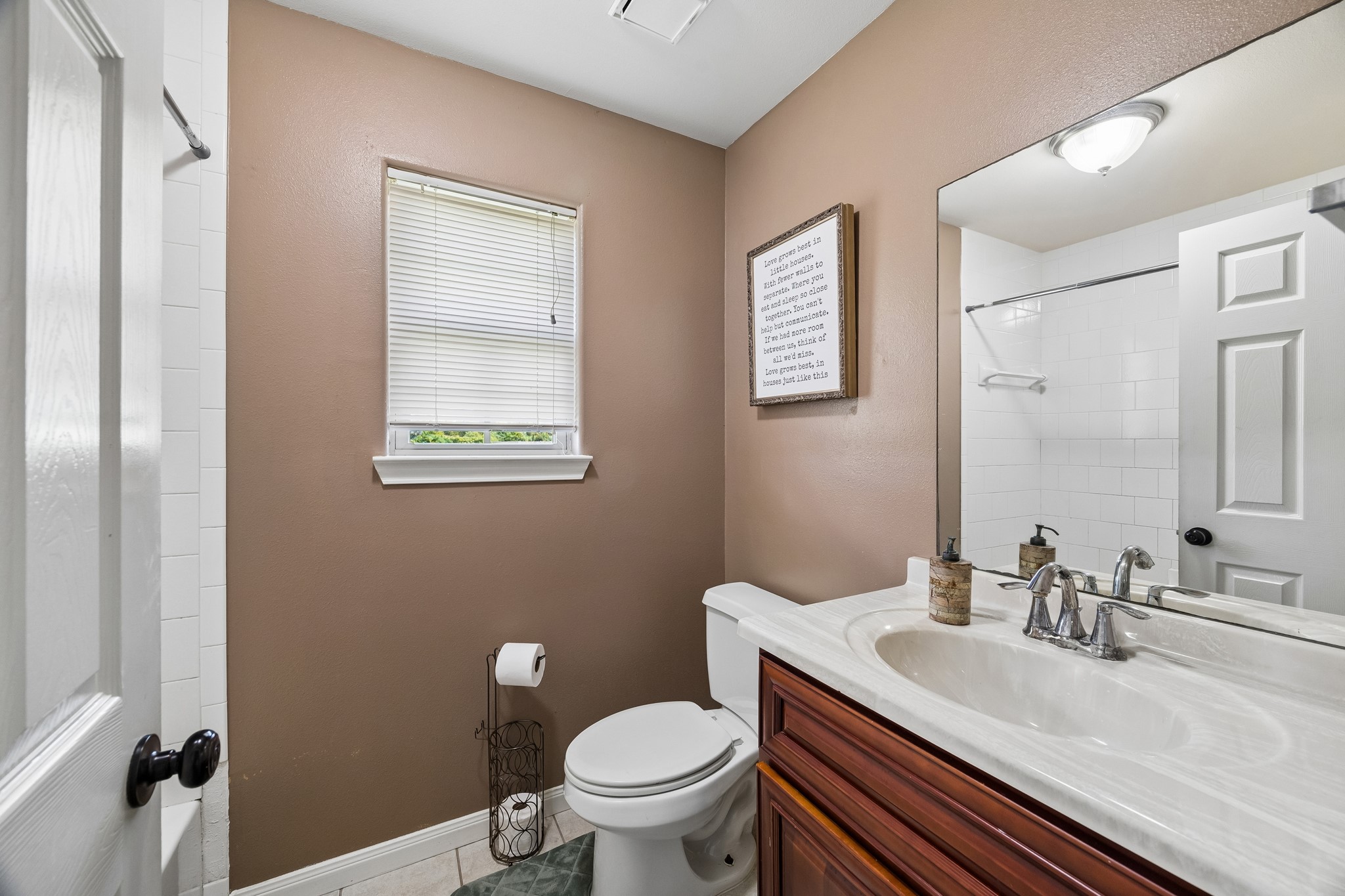 2013 Ellis School Road Baytown, TX 77521 - Photo 27 of 31 One of two full bathrooms serving the residence’s three-bedroom layout, offering a bright and practical space.