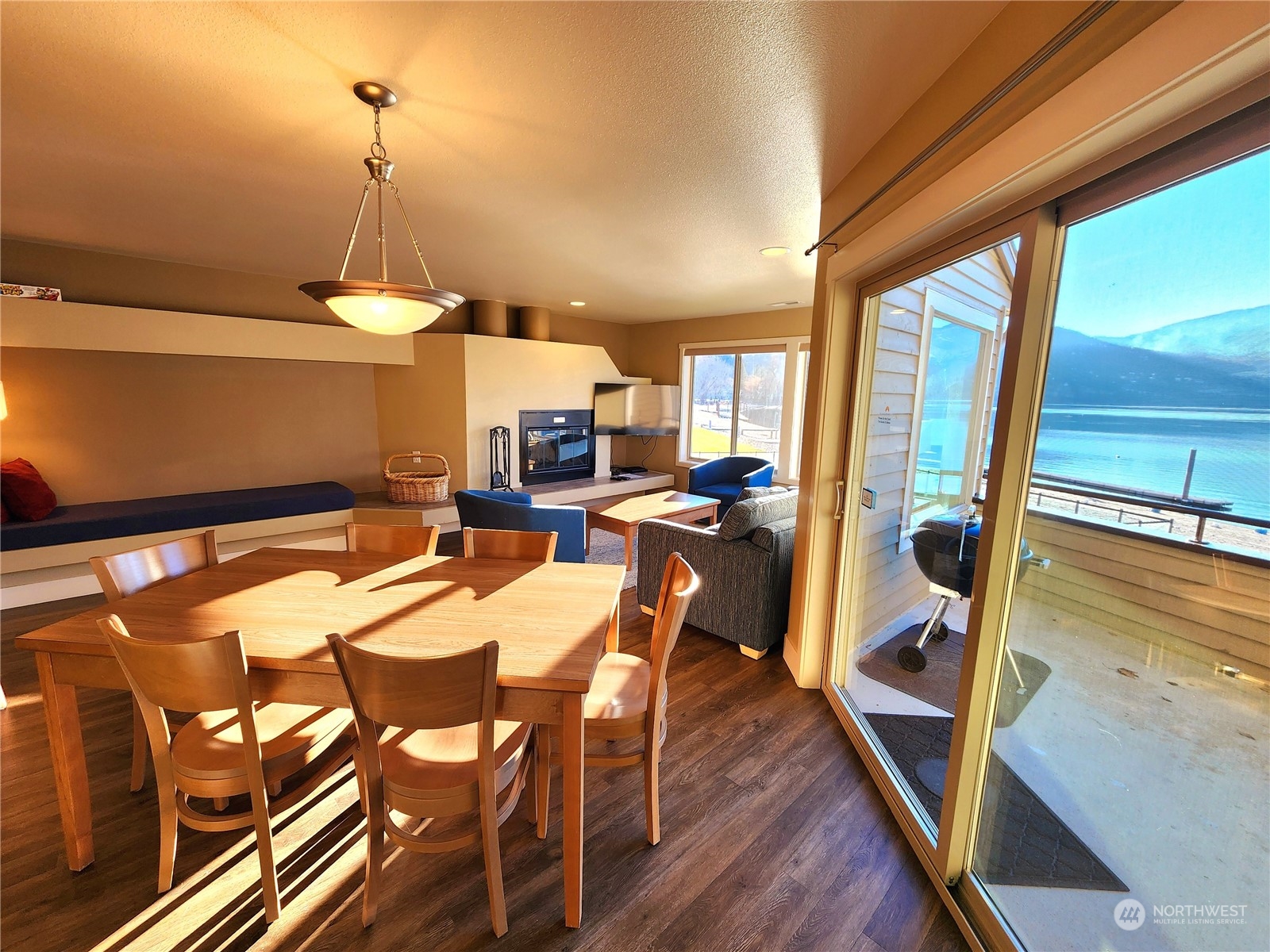 1 Lakeside 707-j Manson, WA 98831 - Photo 12 of 40 a view of a dining room with furniture wooden floor and chandelier