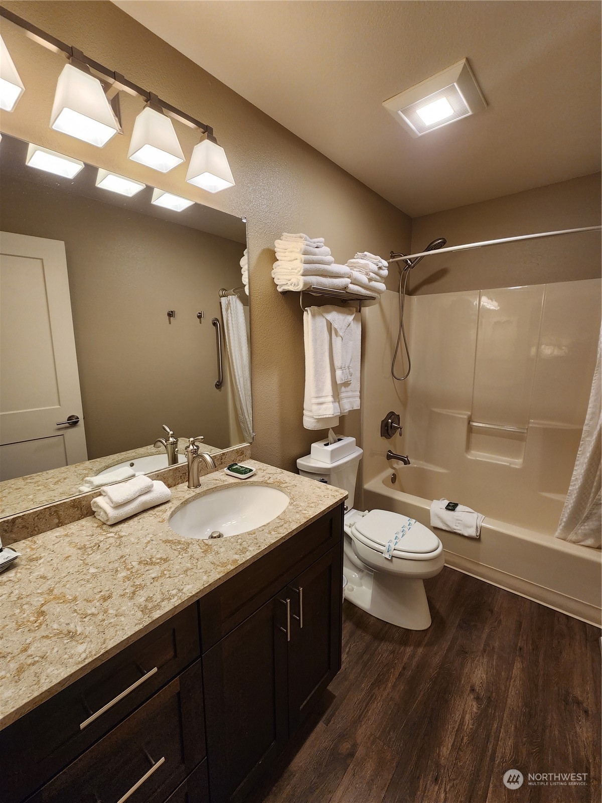 1 Lakeside 707-j Manson, WA 98831 - Photo 14 of 40 a bathroom with a granite countertop sink toilet and shower