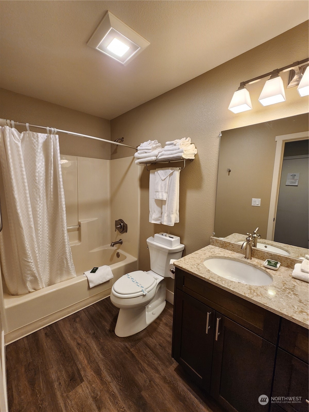 1 Lakeside 707-j Manson, WA 98831 - Photo 16 of 40 a bathroom with a sink vanity mirror and toilet