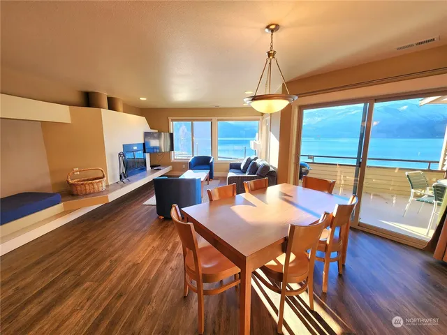 a view of a dining room with furniture window and wooden floor