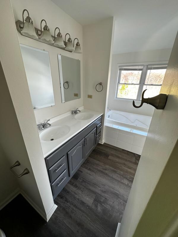 730 Hageman Place Naperville, IL 60563 - Photo 11 of 25 a bathroom with a sink and a mirror