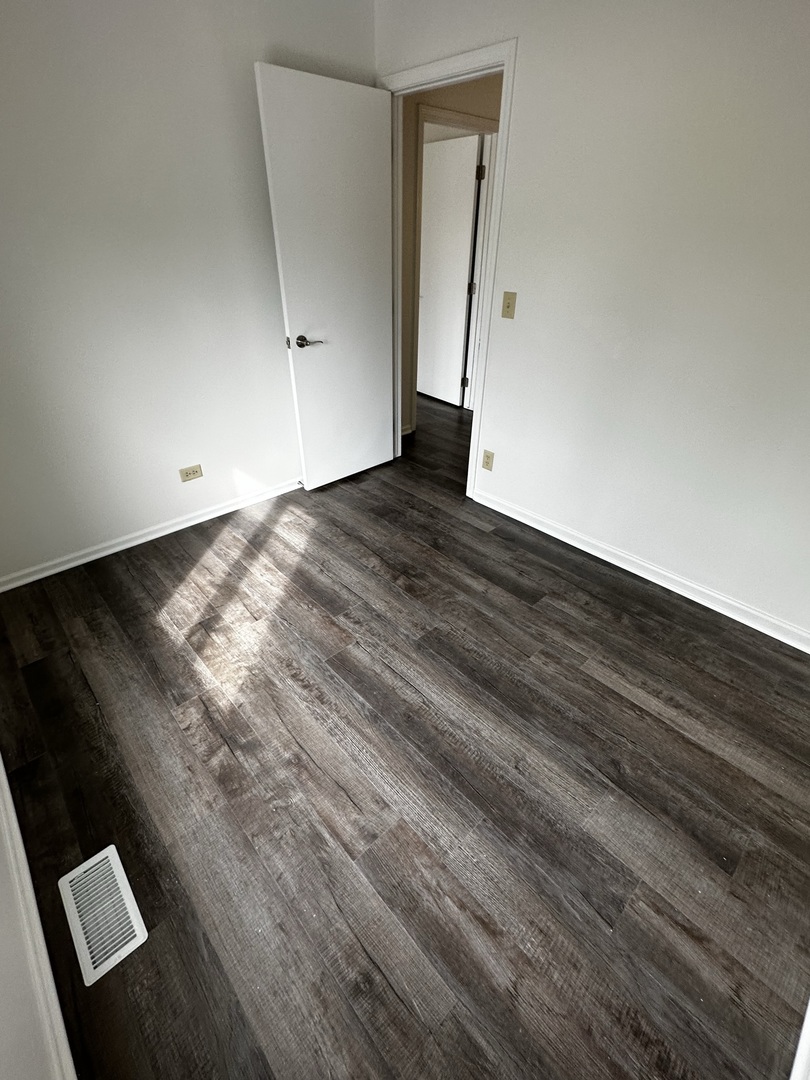 730 Hageman Place Naperville, IL 60563 - Photo 20 of 25 an empty room with wooden floor