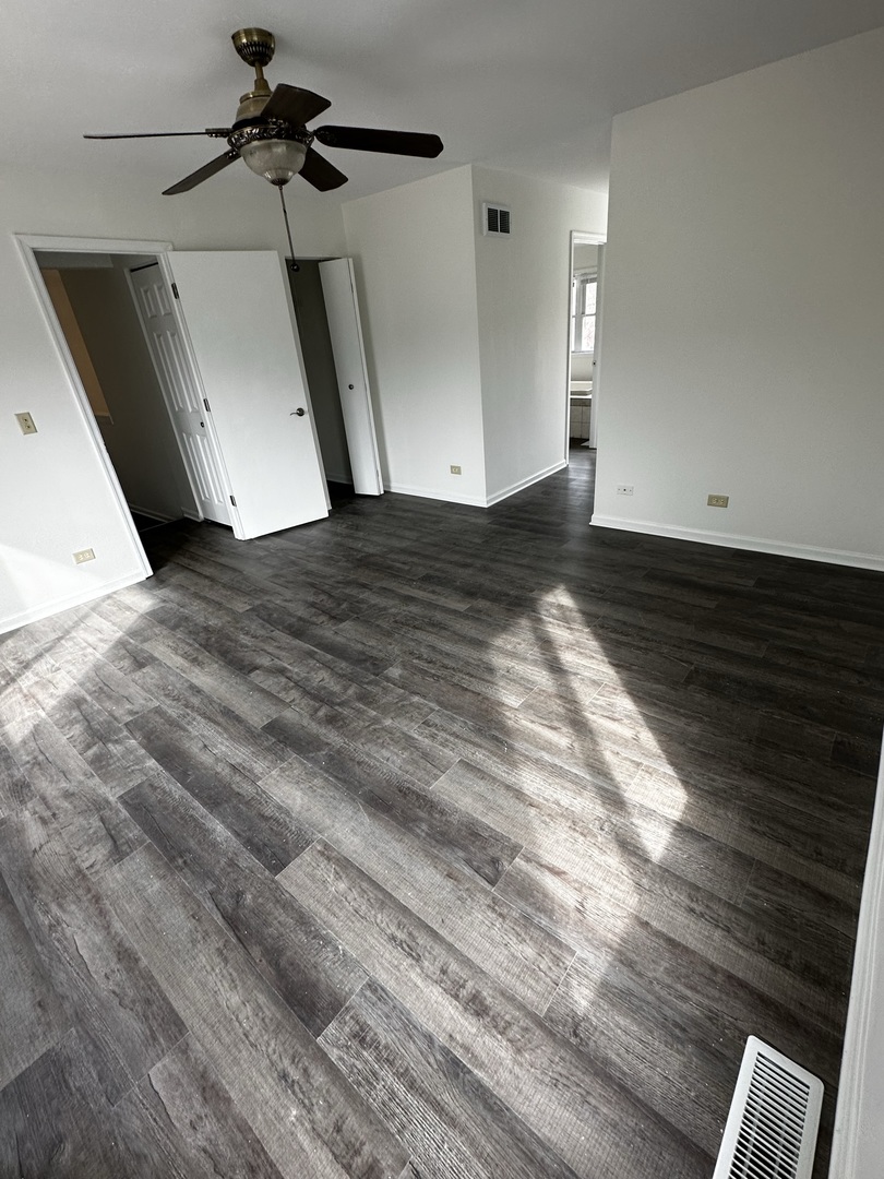 730 Hageman Place Naperville, IL 60563 - Photo 7 of 25 a view of empty room with wooden floor