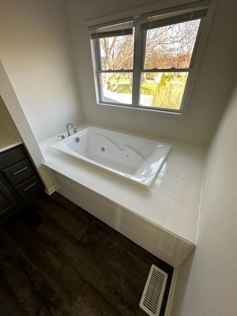 730 Hageman Place Naperville, IL 60563 - Photo 8 of 25 a bathroom with a sink a window and a mirror