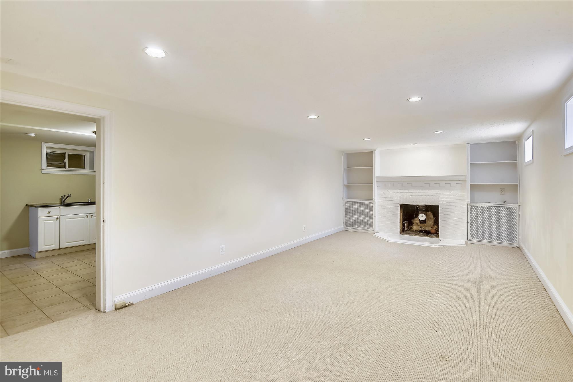908 West Braddock Road Alexandria, VA 22302 - Photo 45 of 61 Recreation Room with wood burning fireplace