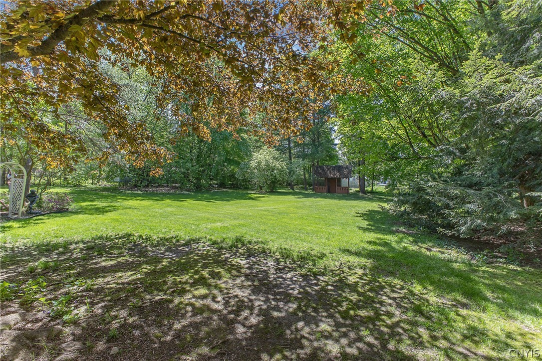 31 Lyndon Road Fayetteville, NY 13066 - Photo 40 of 47 Enjoy your fully fenced in backyard with a double gate on the left,
and a single gate on the right. There is a shed-playhouse in the rear .