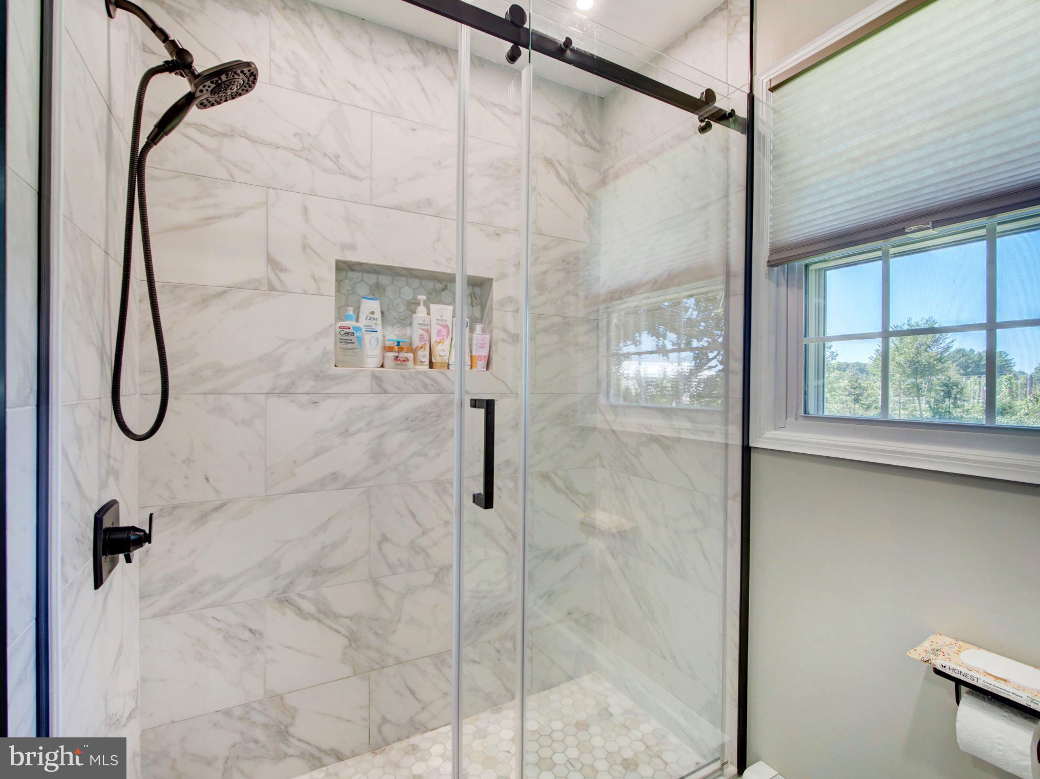 86 Extonville Road Hamilton, NJ 08620 - Photo 19 of 27 Sleek marble shower with natural light.