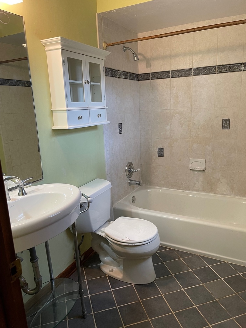 2013 Hickory Street Waukegan, IL 60087 - Photo 15 of 25 a bathroom with a sink toilet and shower
