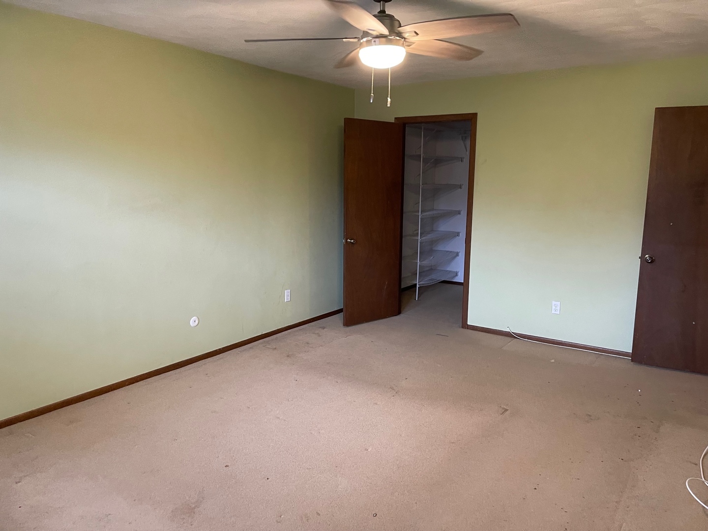 2013 Hickory Street Waukegan, IL 60087 - Photo 16 of 25 a view of an empty room with a chandelier fan