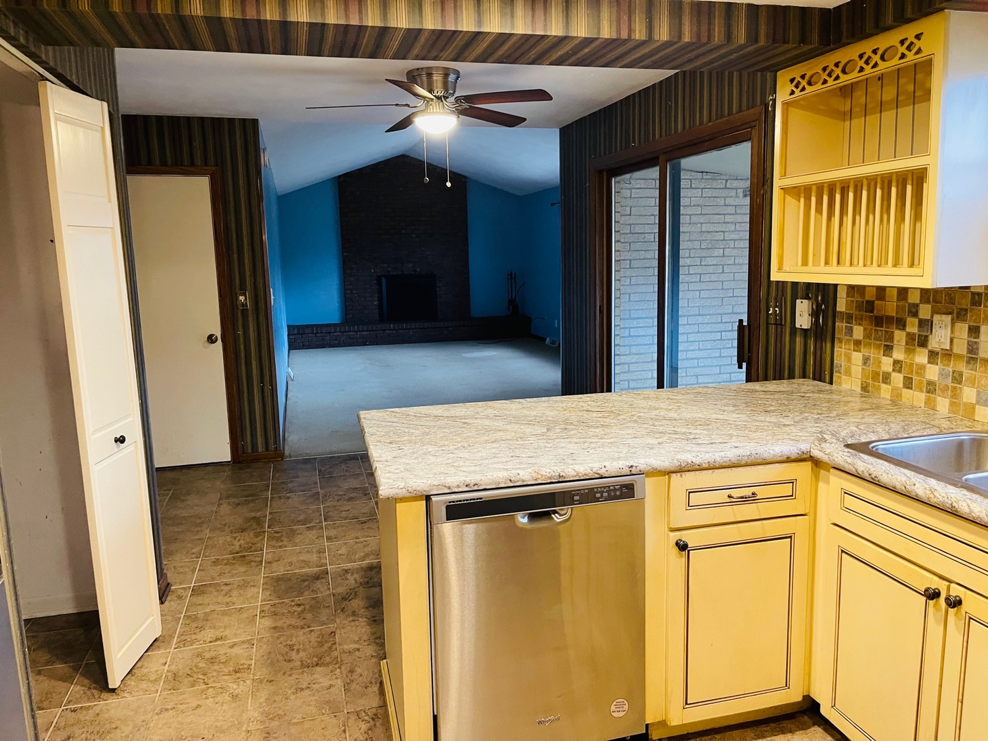 2013 Hickory Street Waukegan, IL 60087 - Photo 5 of 25 a view of a kitchen with a sink and a refrigerator