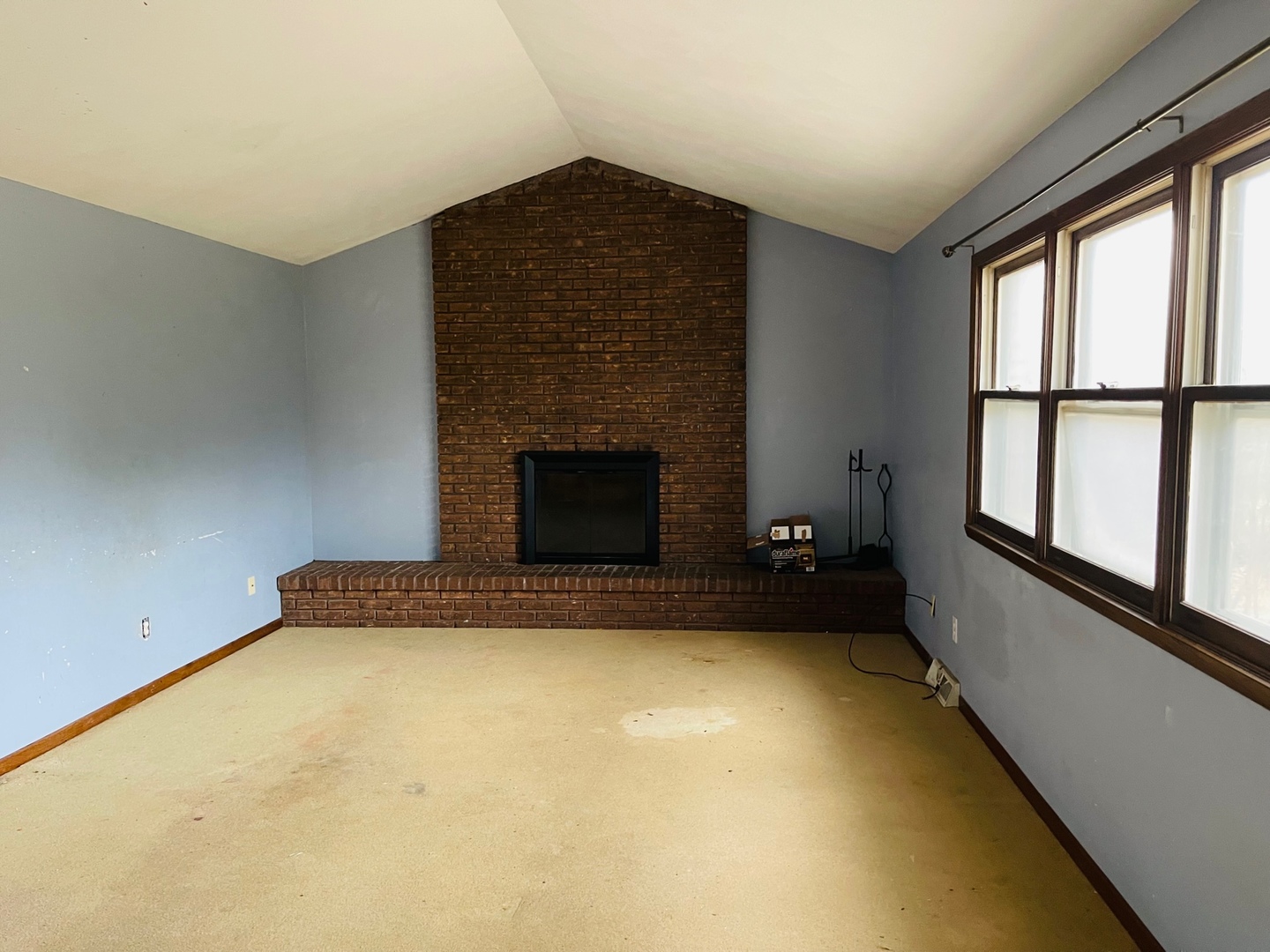 2013 Hickory Street Waukegan, IL 60087 - Photo 6 of 25 a room with a fireplace and windows