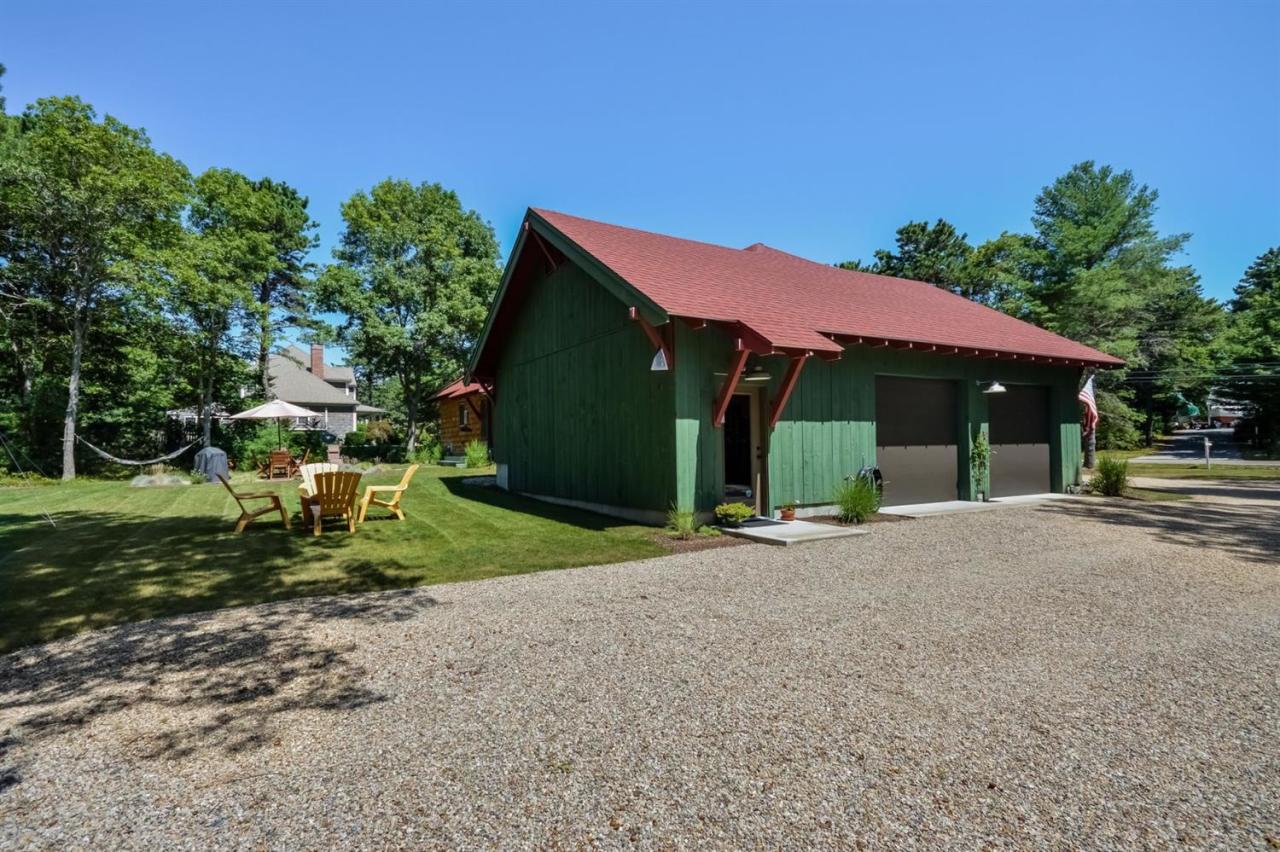 1336 Old Post Road Marstons Mills, MA 02648 - Photo 13 of 16 a view of a house with backyard and trees