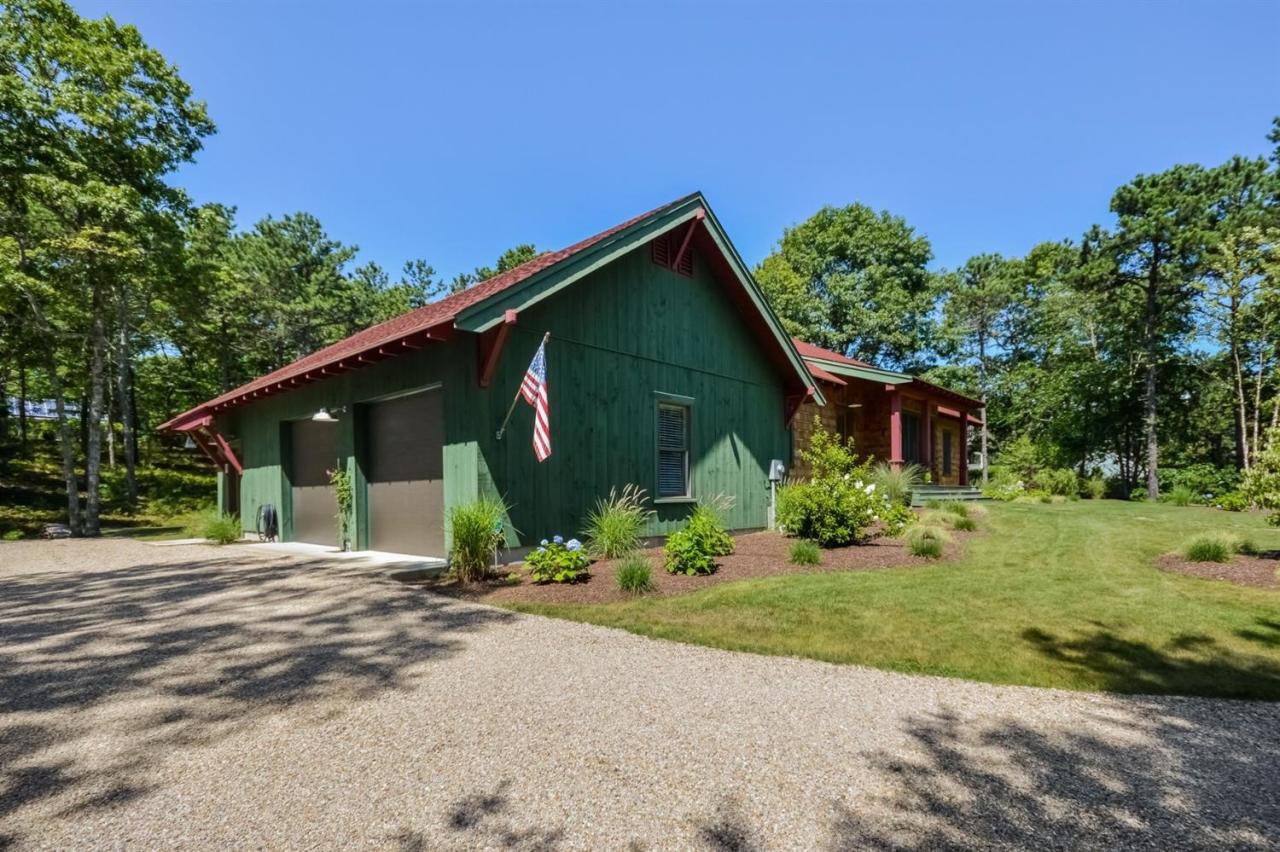1336 Old Post Road Marstons Mills, MA 02648 - Photo 4 of 16 a front view of a house with garden