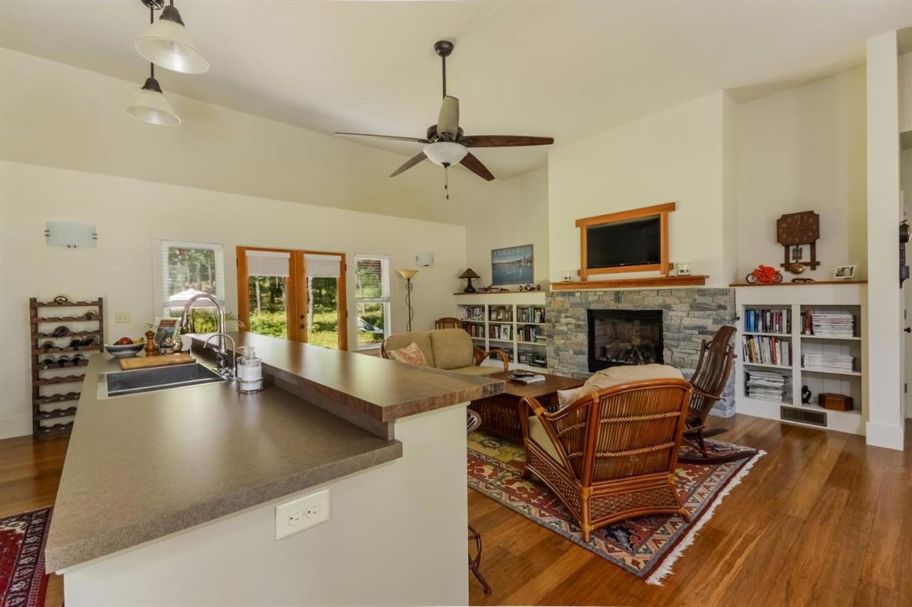 1336 Old Post Road Marstons Mills, MA 02648 - Photo 6 of 16 a living room with furniture a fireplace and a flat screen tv