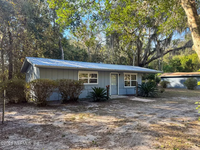 a kitchen with stainless steel appliances a refrigerator stove microwave and sink