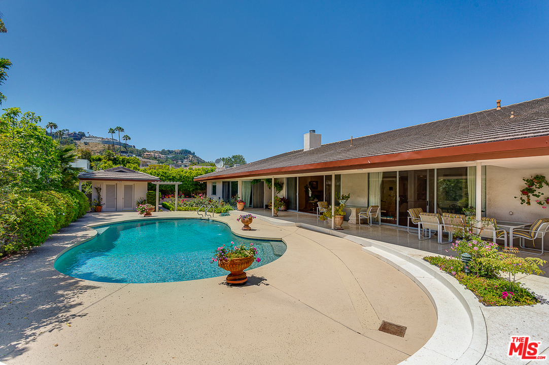 1040 Maybrook Drive Beverly Hills, CA 90210 - Photo 1 of 31 an outdoor space with swimming pool and furniture