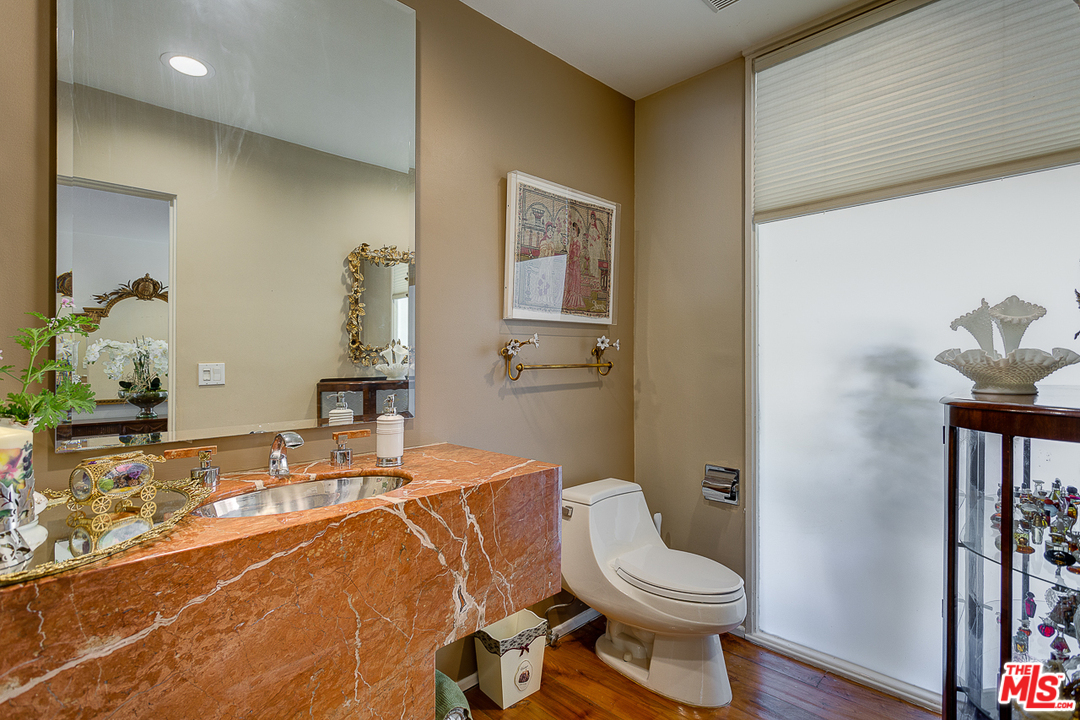 1040 Maybrook Drive Beverly Hills, CA 90210 - Photo 15 of 31 a bathroom with a sink and a toilet