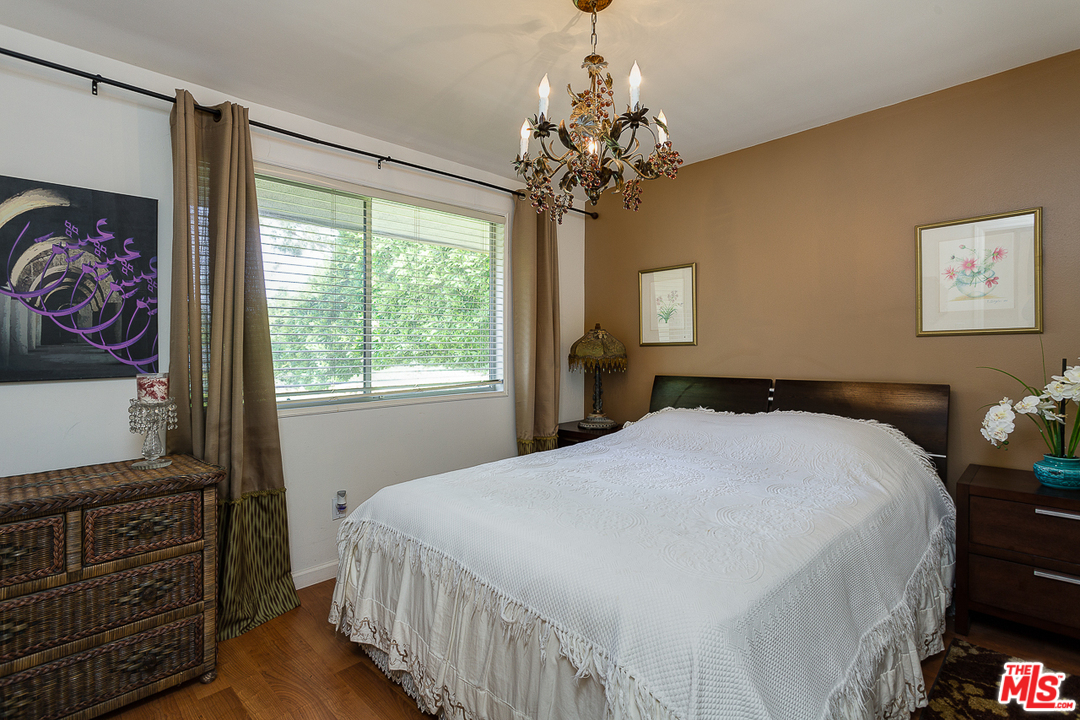 1040 Maybrook Drive Beverly Hills, CA 90210 - Photo 20 of 31 a bedroom with a bed and a flat screen tv