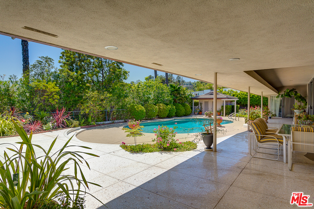 1040 Maybrook Drive Beverly Hills, CA 90210 - Photo 3 of 31 a view of a swimming pool with a patio