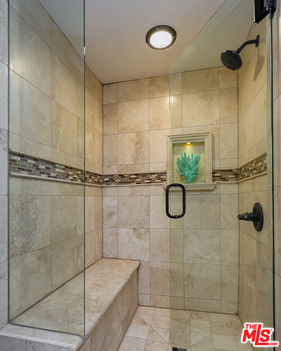 1040 Maybrook Drive Beverly Hills, CA 90210 - Photo 22 of 31 a bathroom with a shower and mirror