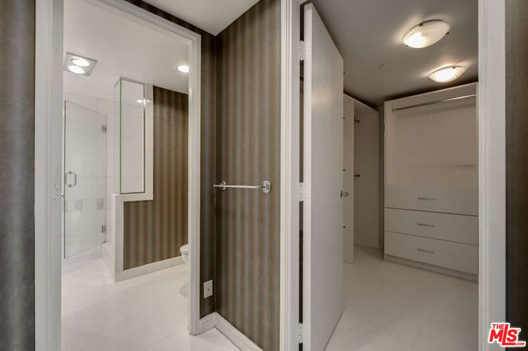 1040 Maybrook Drive Beverly Hills, CA 90210 - Photo 27 of 31 a view of a hallway with closet