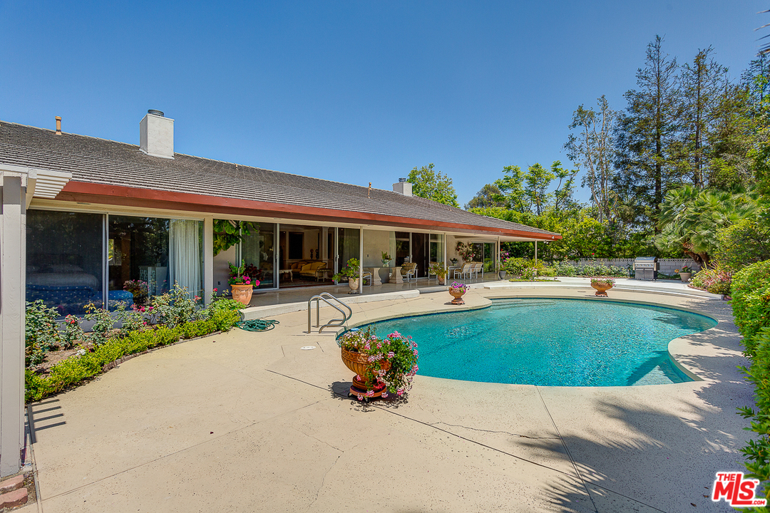 1040 Maybrook Drive Beverly Hills, CA 90210 - Photo 4 of 31 a view of a house with sitting area and garden