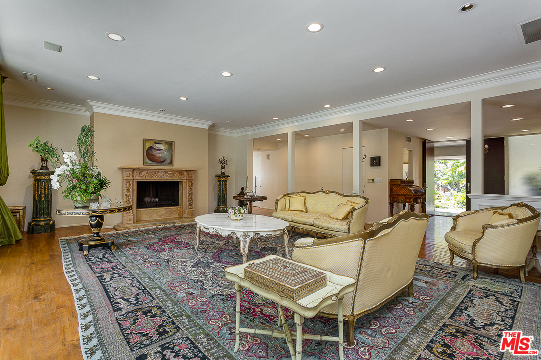 1040 Maybrook Drive Beverly Hills, CA 90210 - Photo 7 of 31 a living room with furniture and a fireplace
