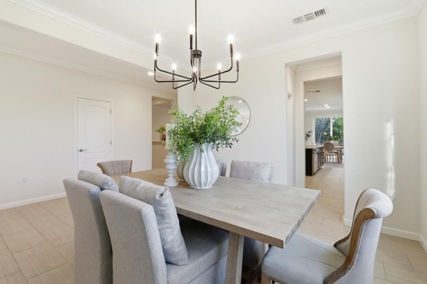18800 Paprika Drive Morgan Hill, CA 95037 - Photo 12 of 64 a view of a dining room with furniture and a chandelier