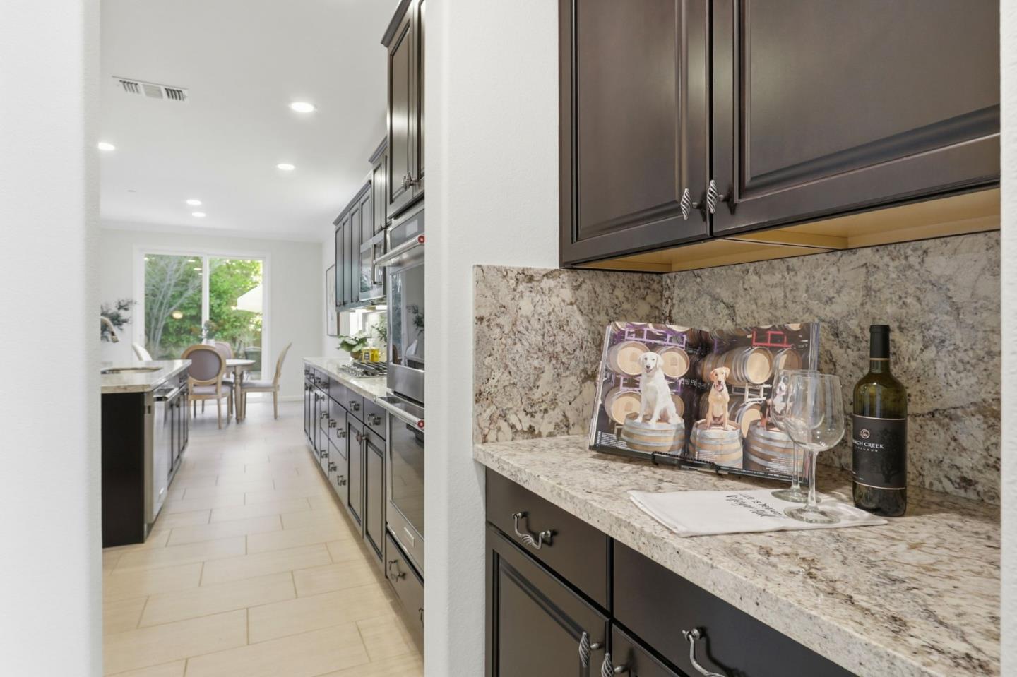 18800 Paprika Drive Morgan Hill, CA 95037 - Photo 13 of 64 a kitchen with granite countertop sink and cabinets