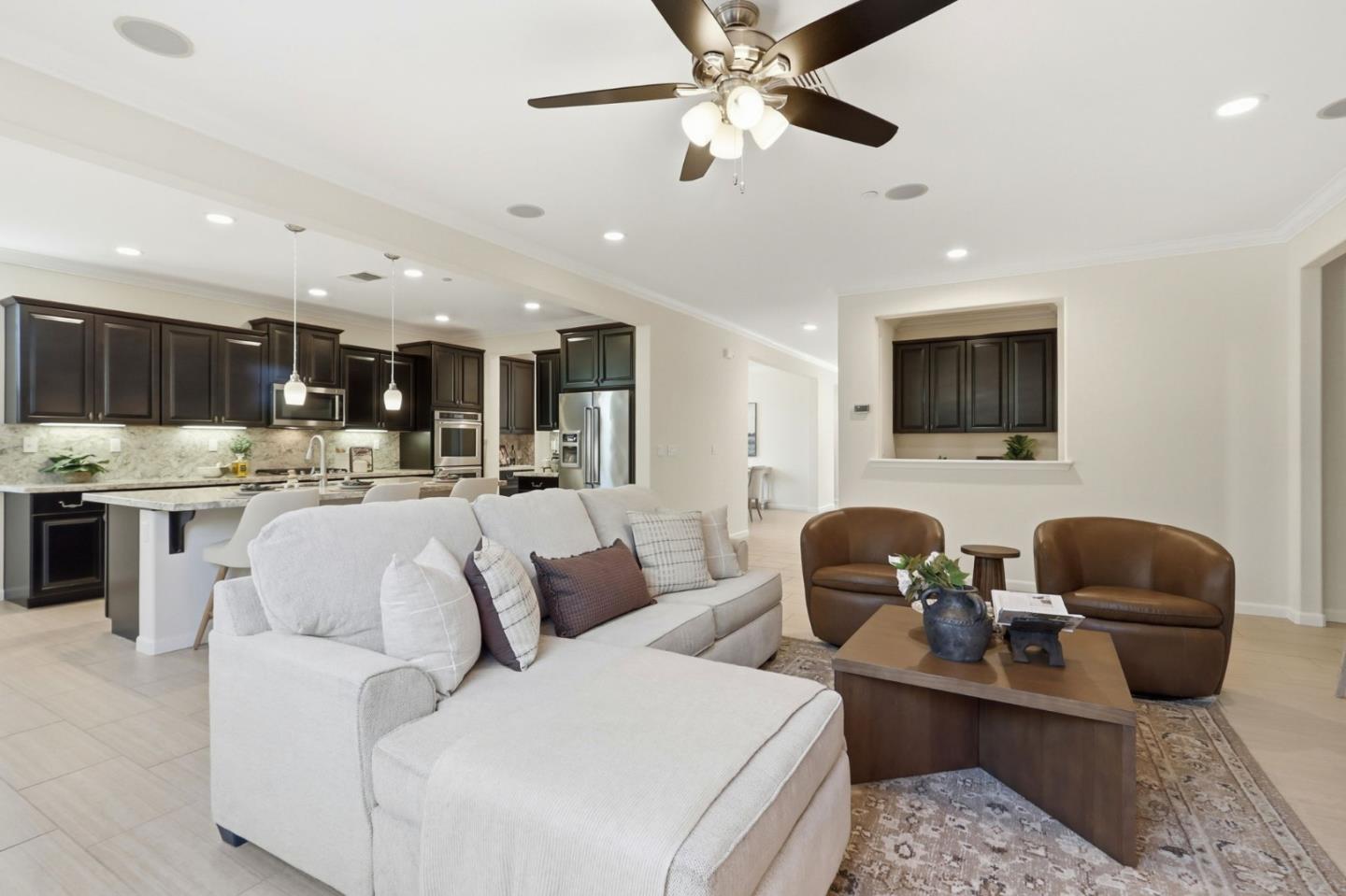 18800 Paprika Drive Morgan Hill, CA 95037 - Photo 25 of 64 a living room with furniture kitchen view and a flat screen tv