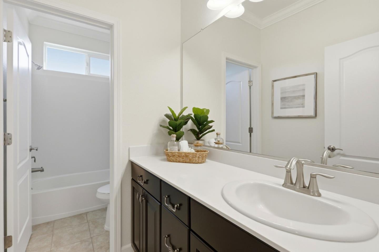 18800 Paprika Drive Morgan Hill, CA 95037 - Photo 40 of 64 a bathroom with a granite countertop sink a toilet and a bathtub