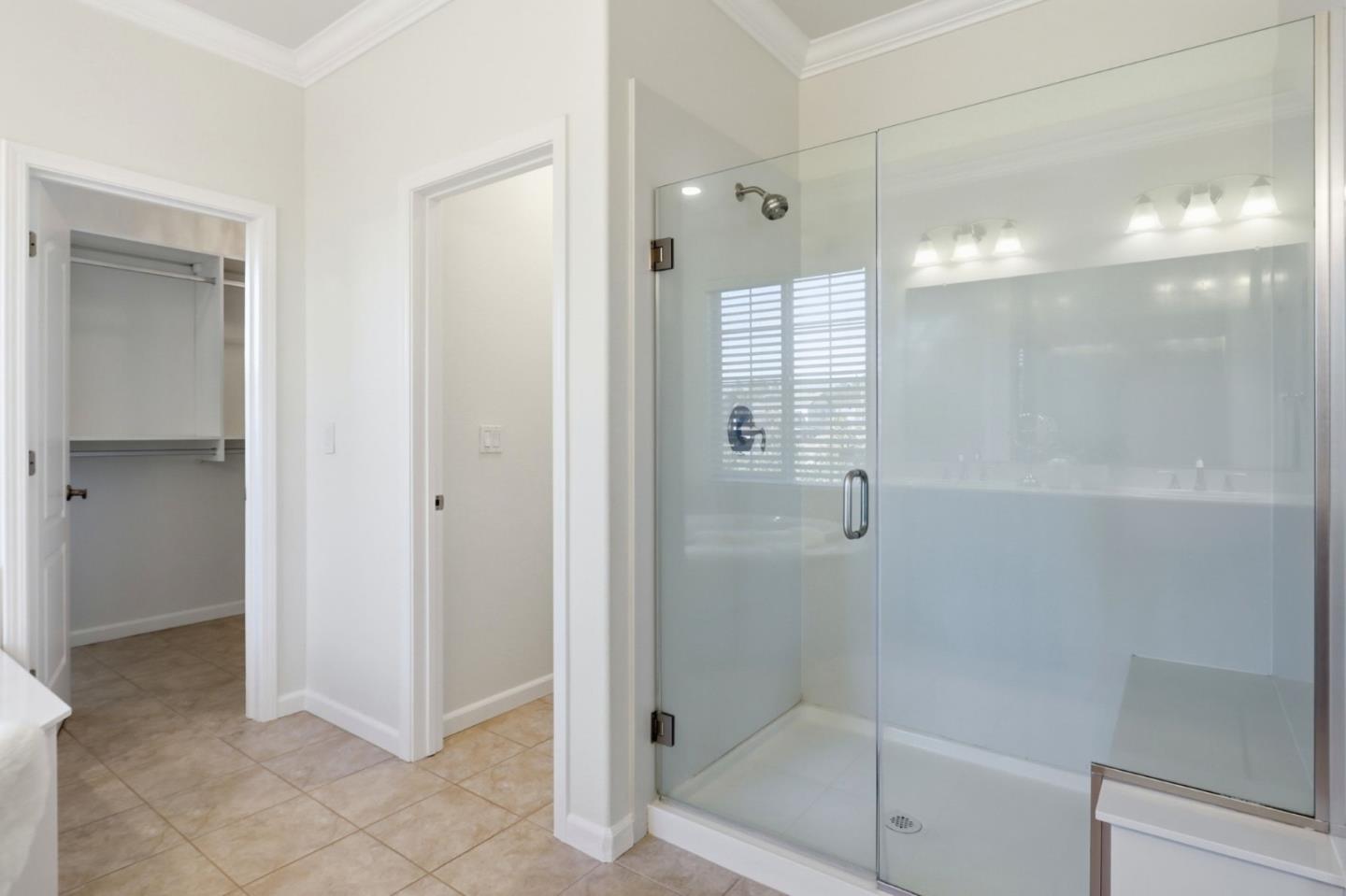 18800 Paprika Drive Morgan Hill, CA 95037 - Photo 52 of 64 a bathroom with a glass shower door
