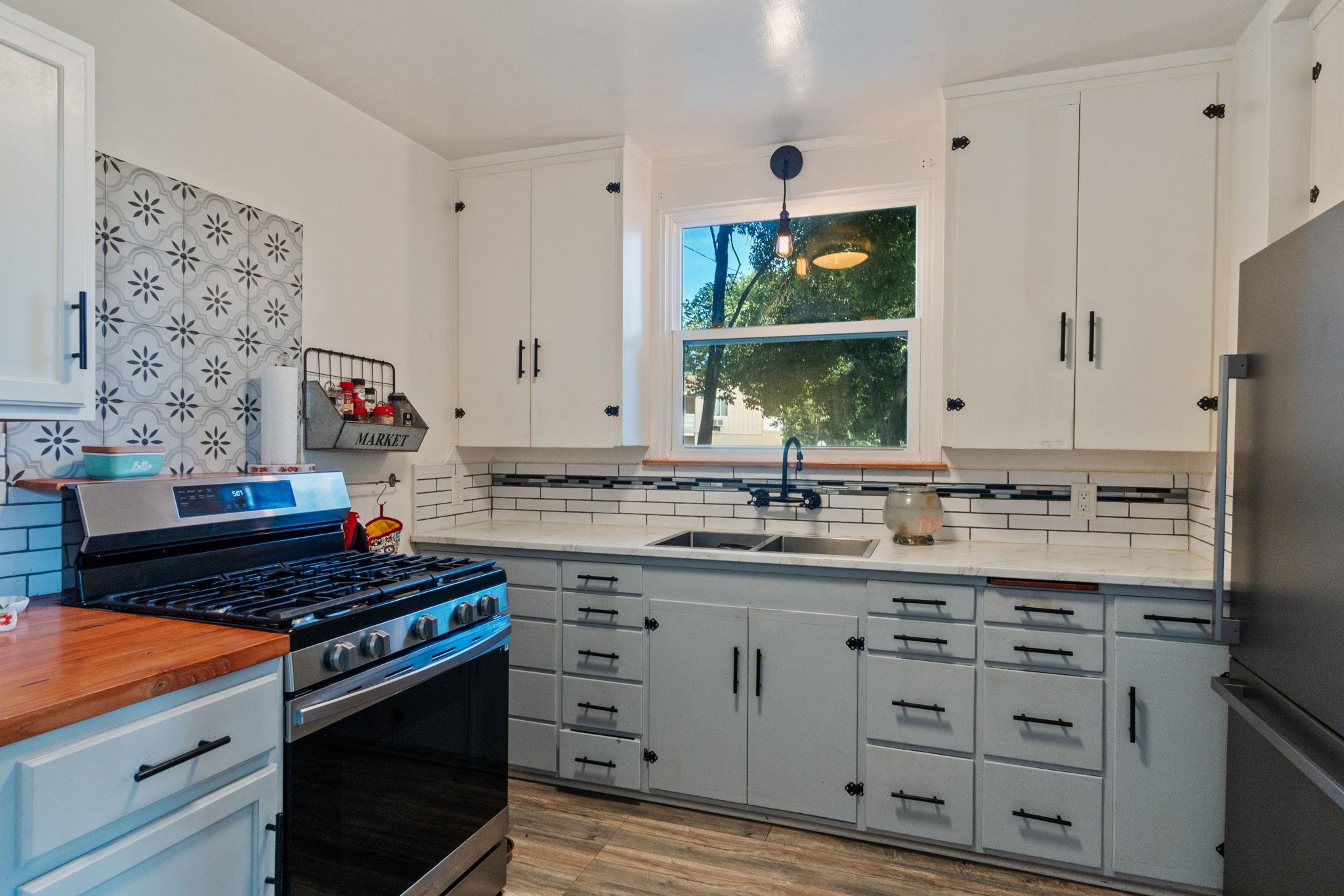 355 Jackson Street Red Bluff, CA 96080 - Photo 8 of 24 a kitchen with cabinets and window