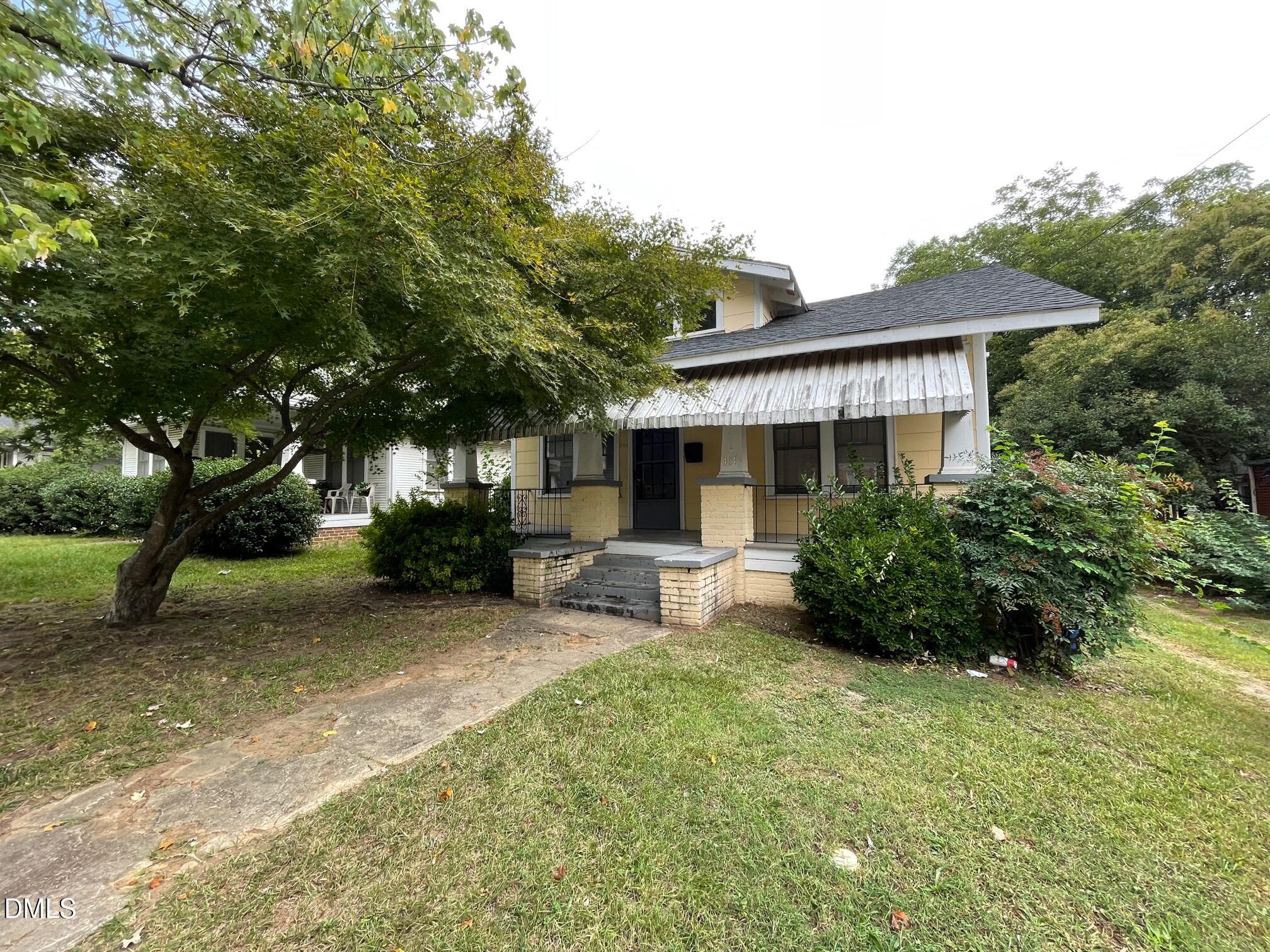 404 Chamberlain Street, Unit A Raleigh, NC 27607 - Photo 1 of 12 a view of a house with backyard and sitting area