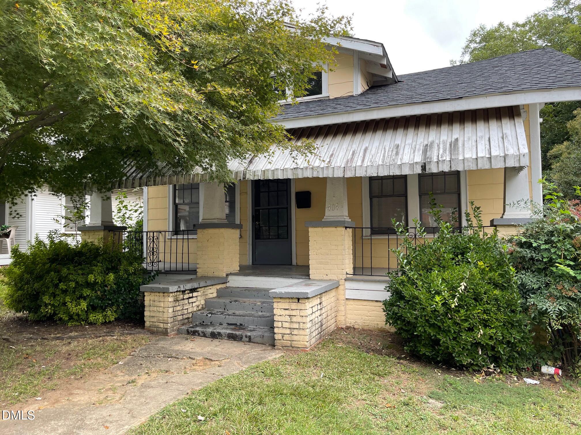 404 Chamberlain Street, Unit A Raleigh, NC 27607 - Photo 2 of 12 a front view of a house with garden