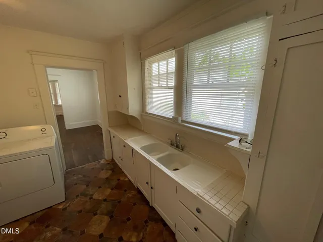 a bathroom with a sink a toilet and tub
