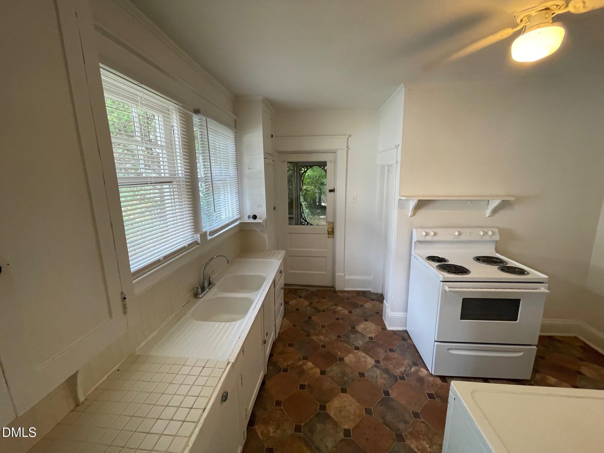 404 Chamberlain Street, Unit A Raleigh, NC 27607 - Photo 8 of 12 a bathroom with a sink and a bathtub