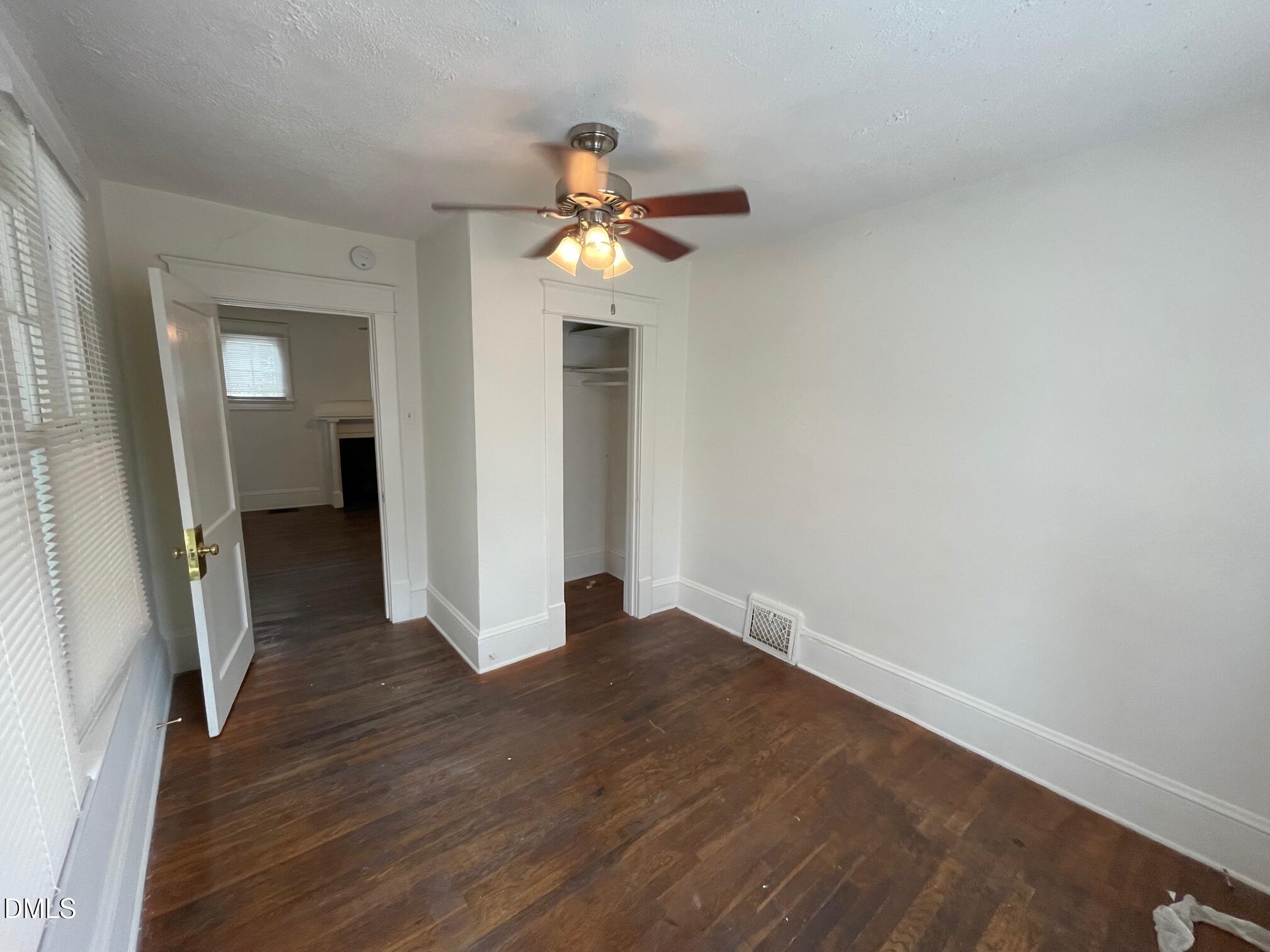 404 Chamberlain Street, Unit A Raleigh, NC 27607 - Photo 9 of 12 wooden floor in an empty room with a window